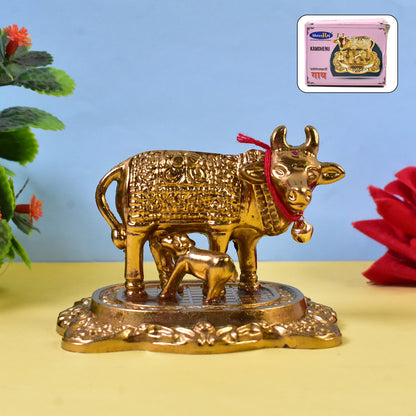 Golden metal Kamdhenu cow with calf sculpture by Wukusy, decorative home improvement figurine for auspicious decor.