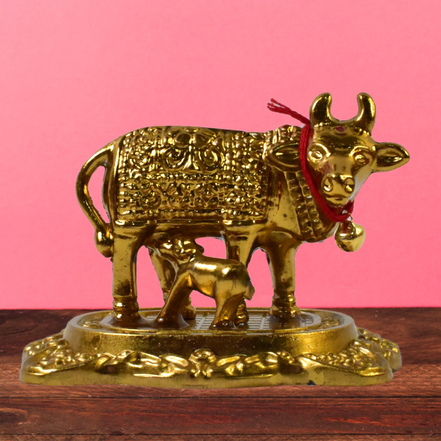 Golden metal Kamdhenu cow with calf sculpture by Wukusy, decorative home improvement figurine for auspicious decor.
