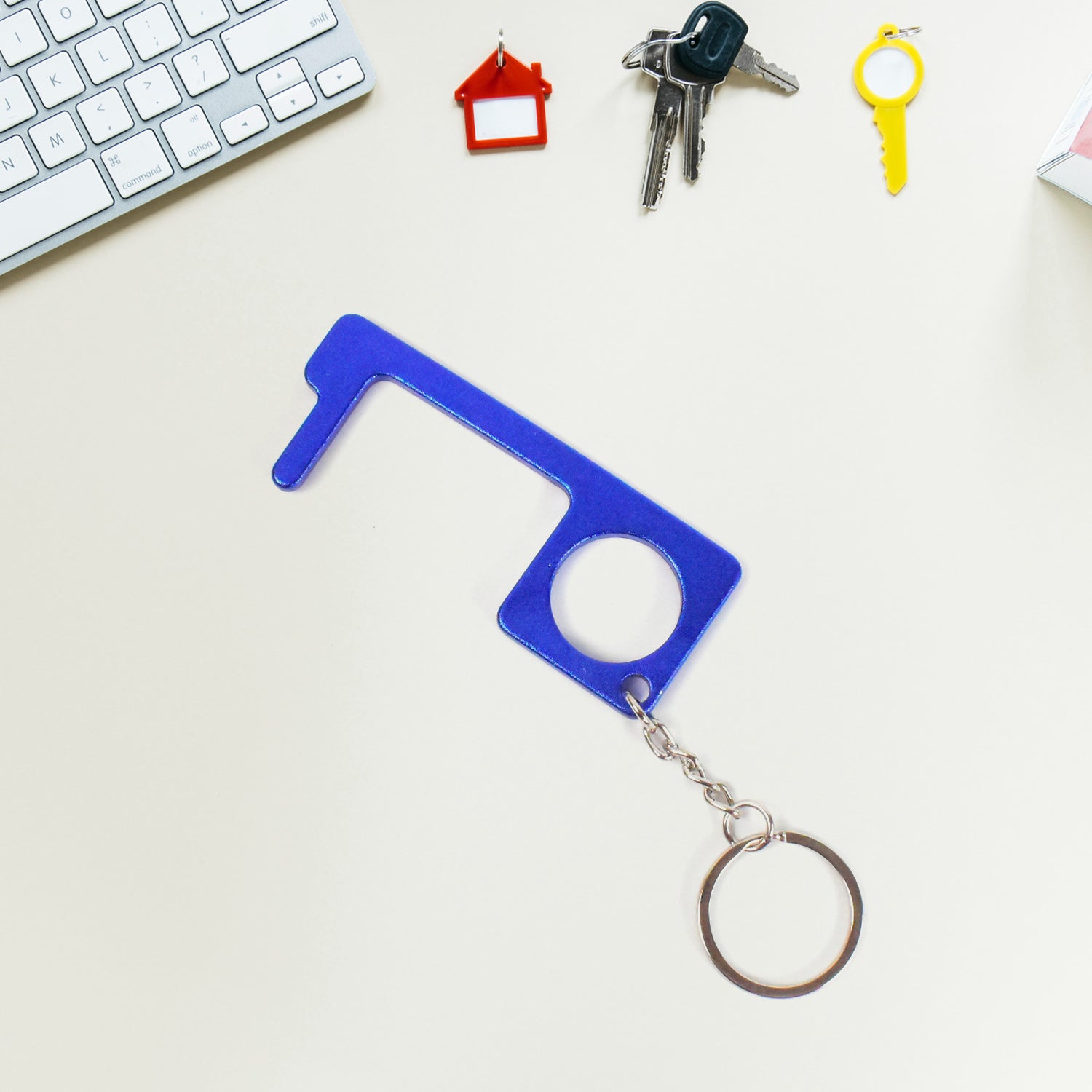 Wukusy metal key shape keychain door opener tool, versatile home improvement accessory with keyring attachment.