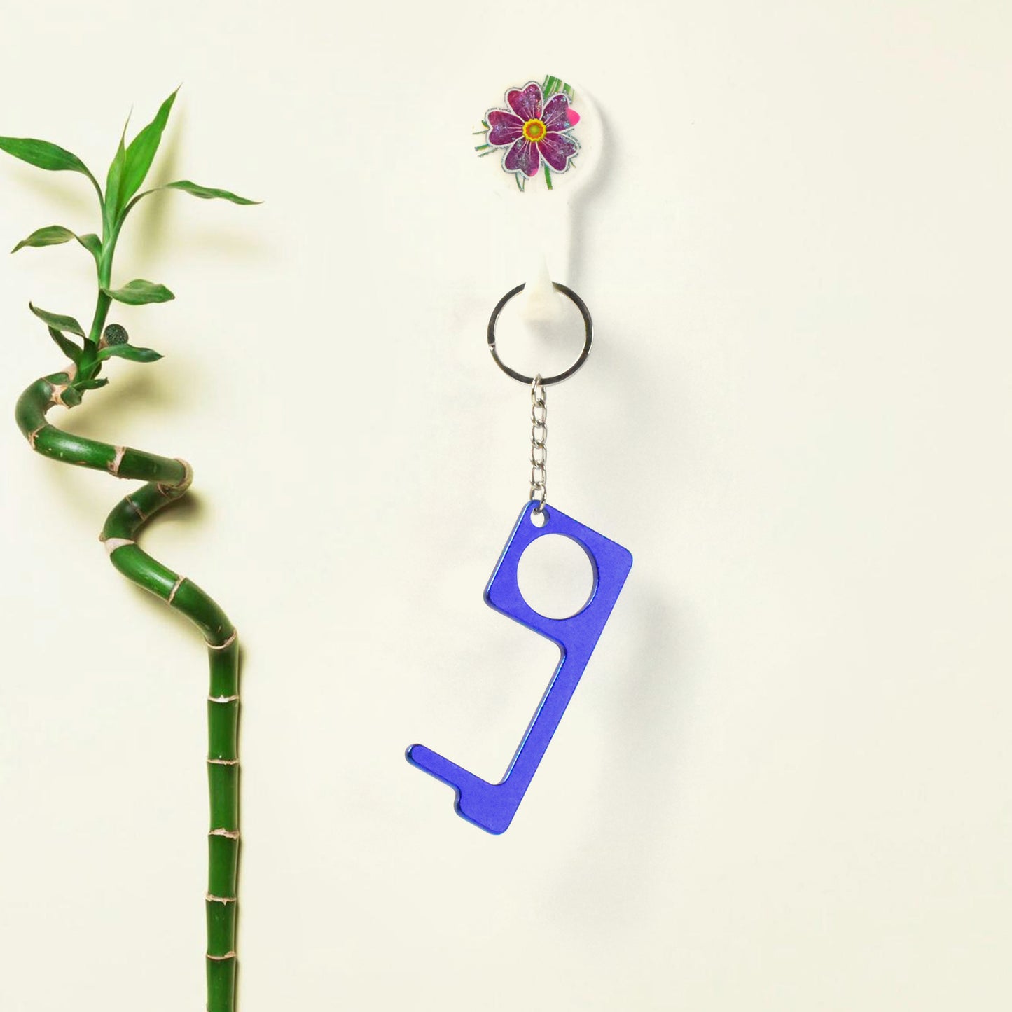 Wukusy metal key shape keychain door opener tool for home improvement, compact and durable keychain accessory.