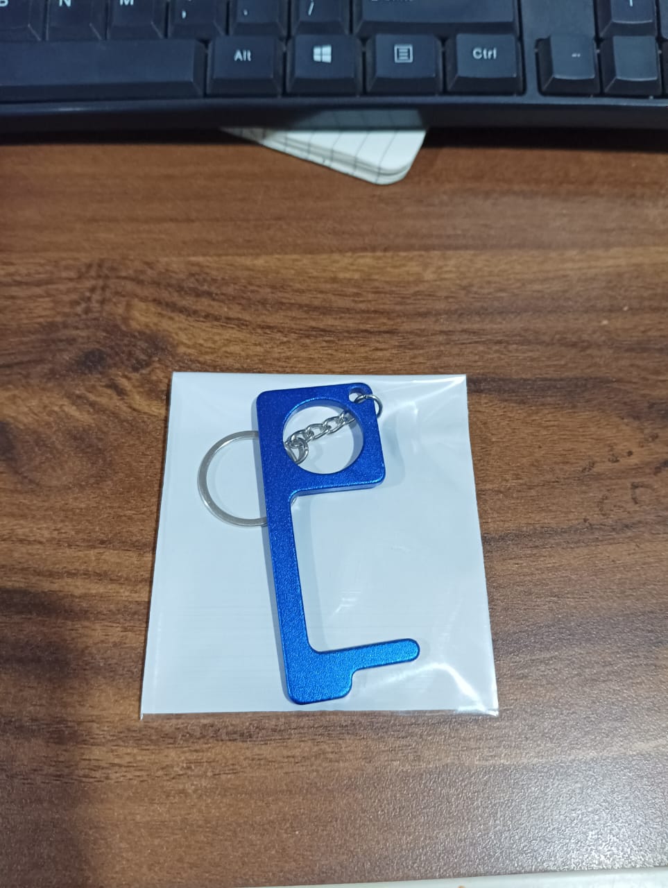 Wukusy metal key shape keychain door opener tool, compact home improvement accessory featuring a keychain design and durable metal construction.