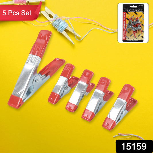 Set of 5 heavy-duty metal spring clamps by Wukusy, ideal for home improvement projects, showing the clamps in a ready position.