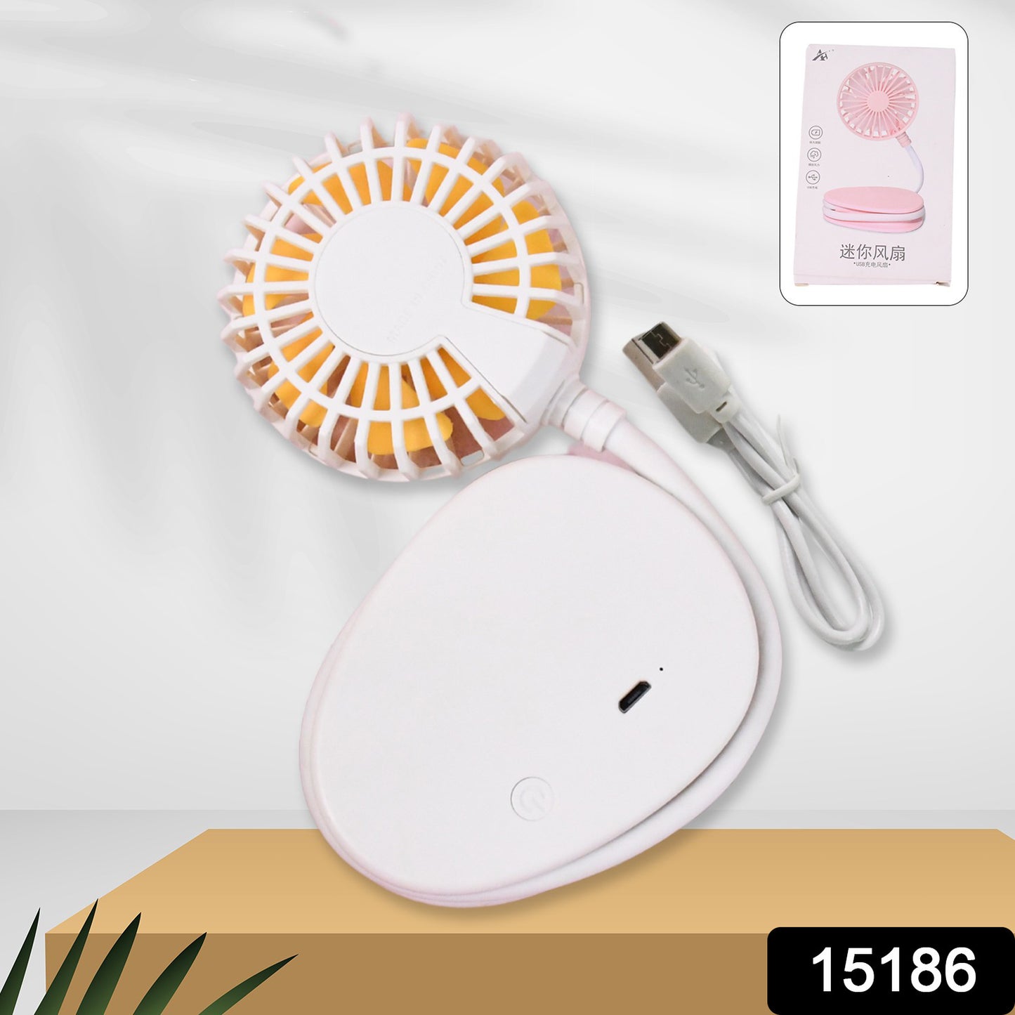 Wukusy mini USB fan, compact portable cooling device for home improvement, shown with blades and USB connector.