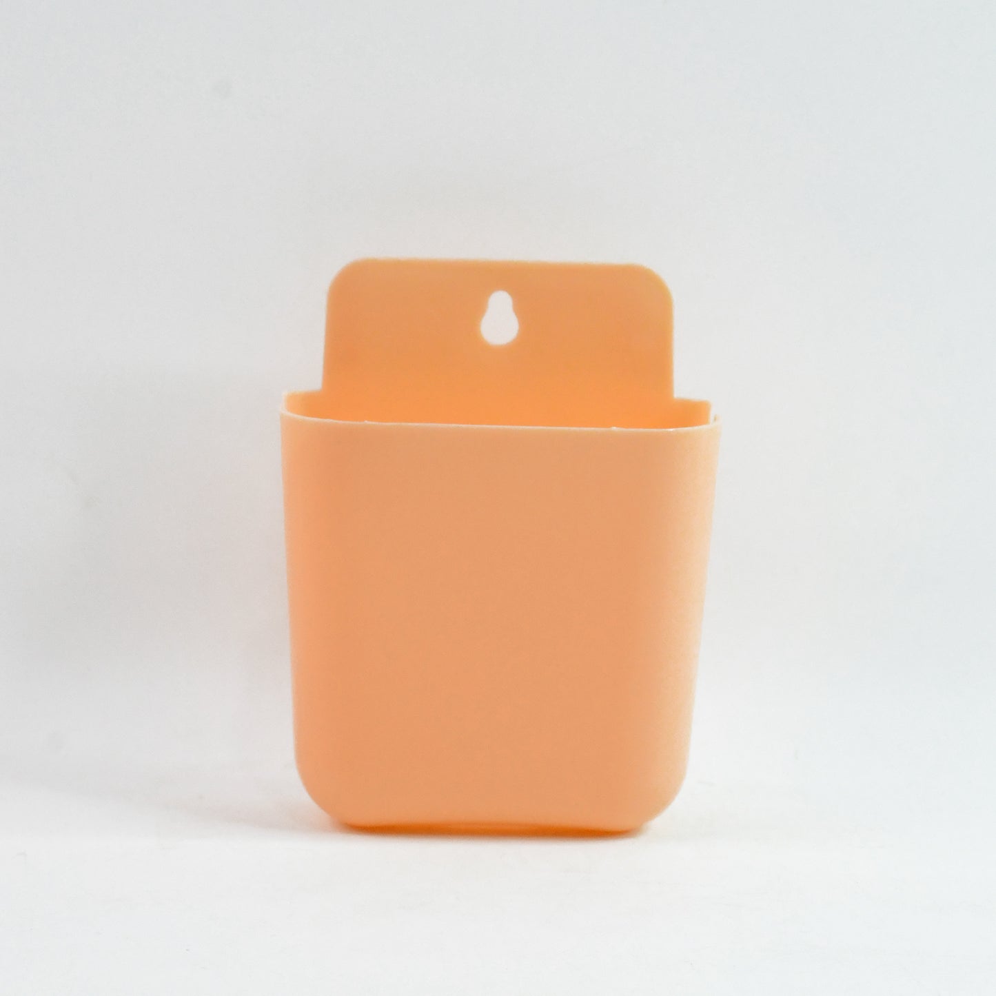 Wukusy multi-purpose wall-mounted plastic storage pocket for home organization, mounted on a wall with multiple compartments.