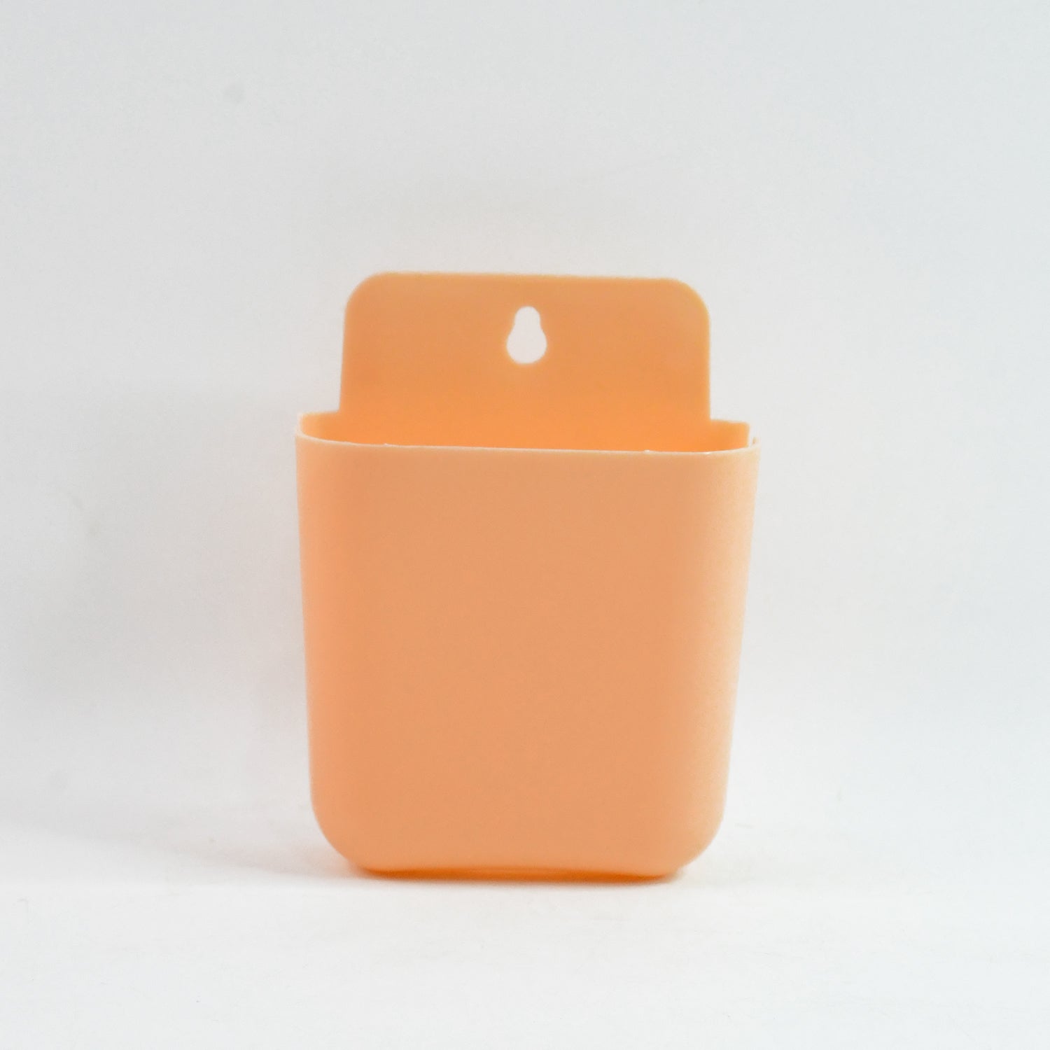 Wukusy multi-purpose wall-mounted plastic storage pocket for home organization, mounted on a wall with multiple compartments.