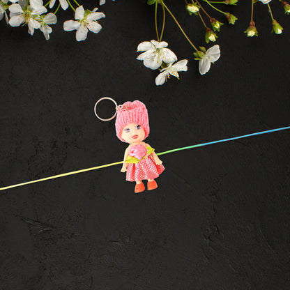 Colorful soft doll Rakhi with keychain for kids by Wukusy, featuring decorative design and suitable for boys and girls.