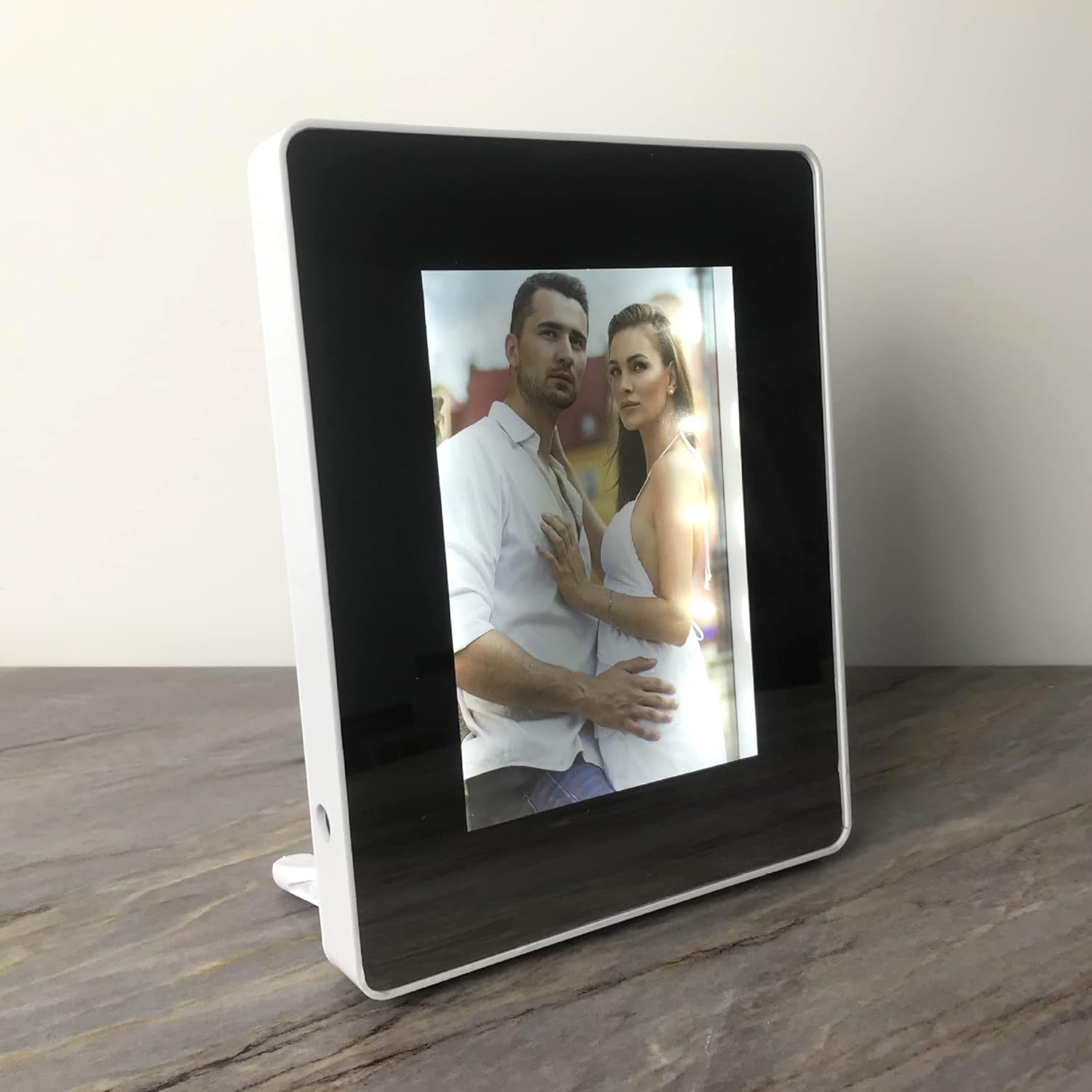 Wukusy multifunctional LED magic mirror with hidden photo frame, modern home improvement decor, reflecting a sleek mirror with photo display