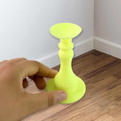 Neon yellow washing machine door stopper by Wukusy, designed to hold the door open and prevent slamming.