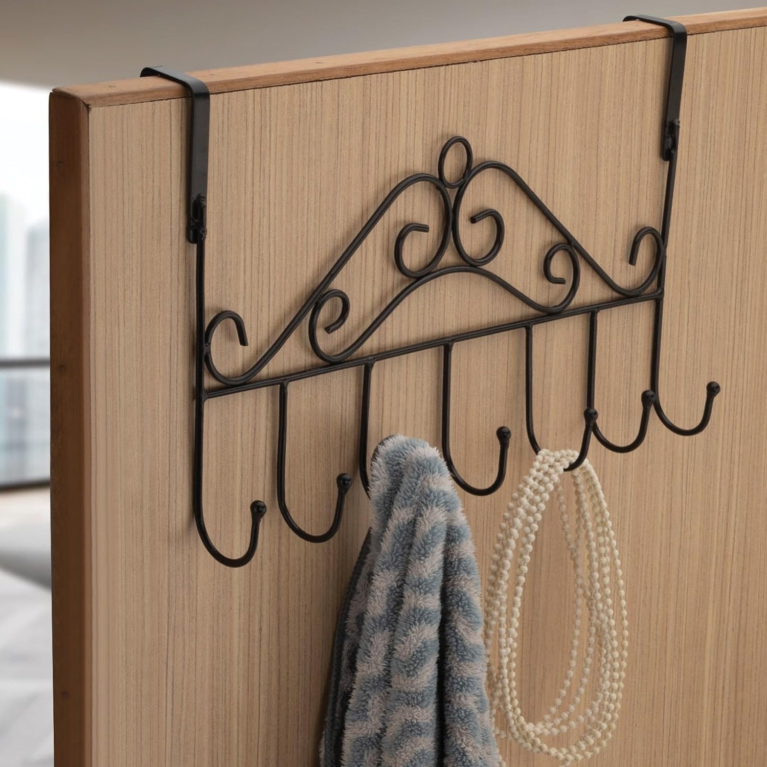 Wukusy over the door hanger rack with 7 metal hooks, decorative and stylish for home or office door organization.