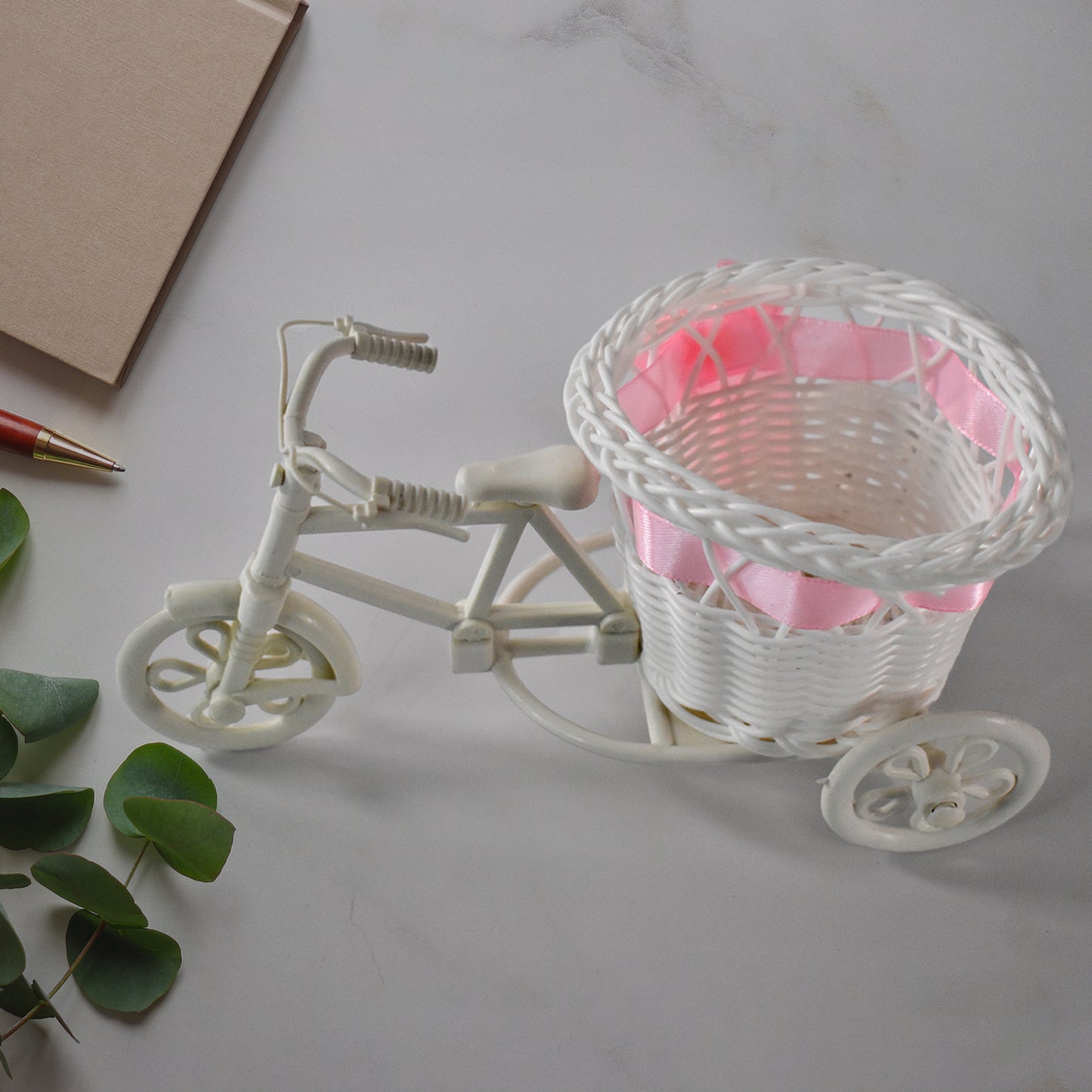 Plastic bicycle-shaped flower vase for home decor, Wukusy cycle flower pot stand, decorative flower holder for indoor use.