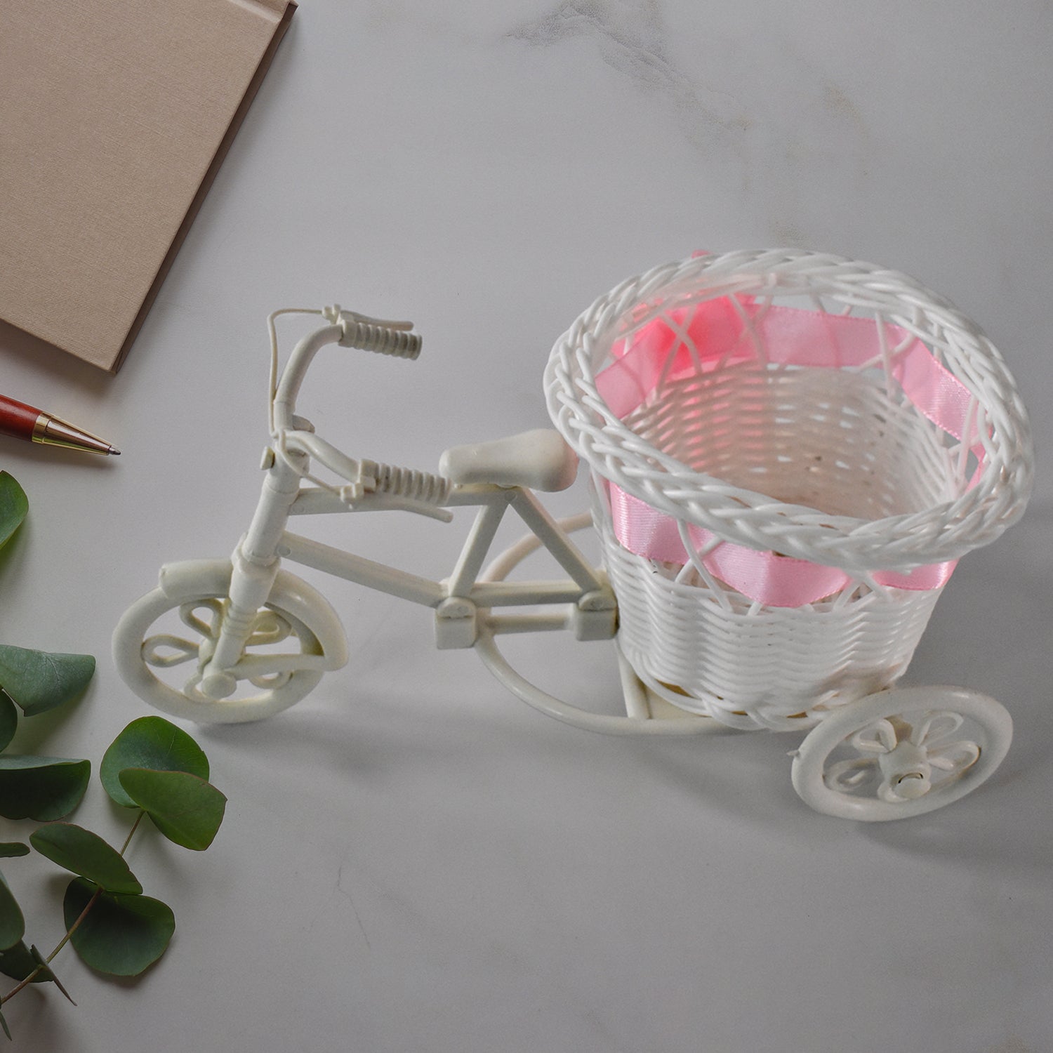 Plastic bicycle-shaped flower vase for home decor, Wukusy cycle flower pot stand, decorative flower holder for indoor use.
