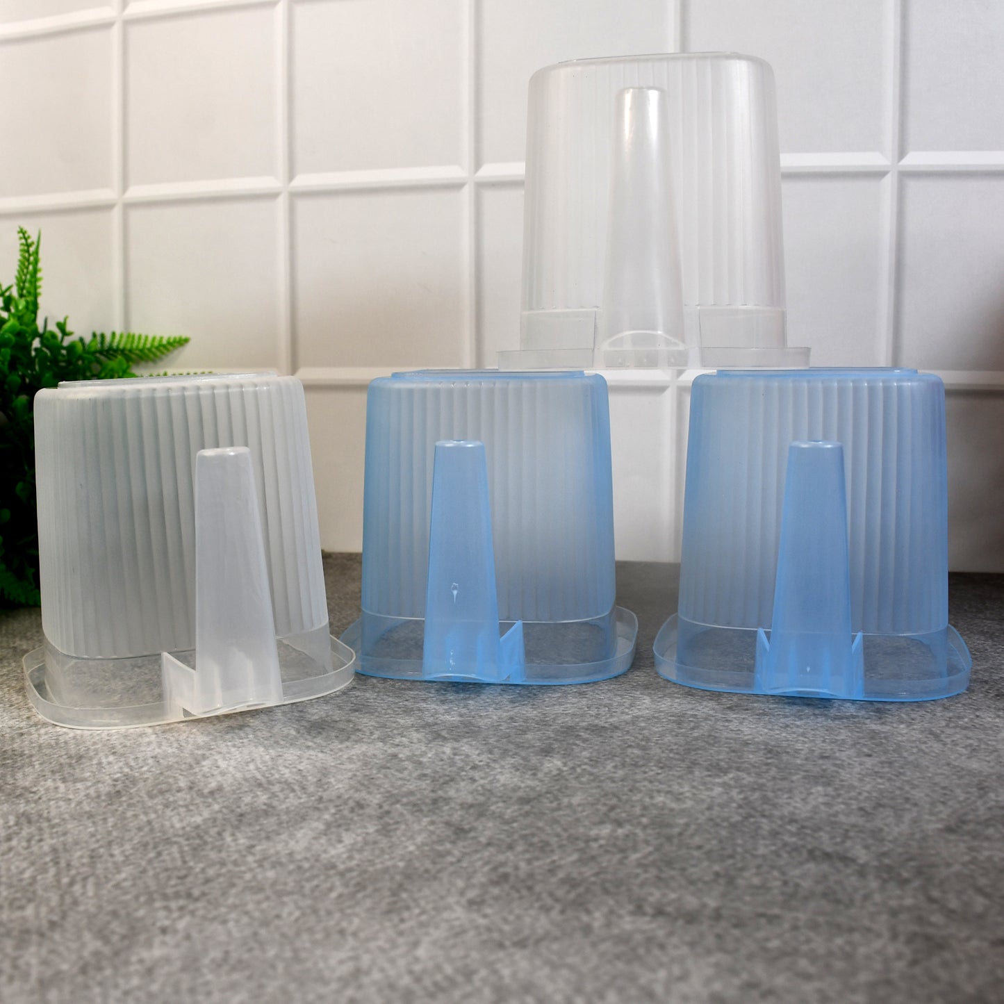 Set of four Wukusy plastic transparent bathroom water mugs in mixed colors, each 1000ml capacity for home improvement use.