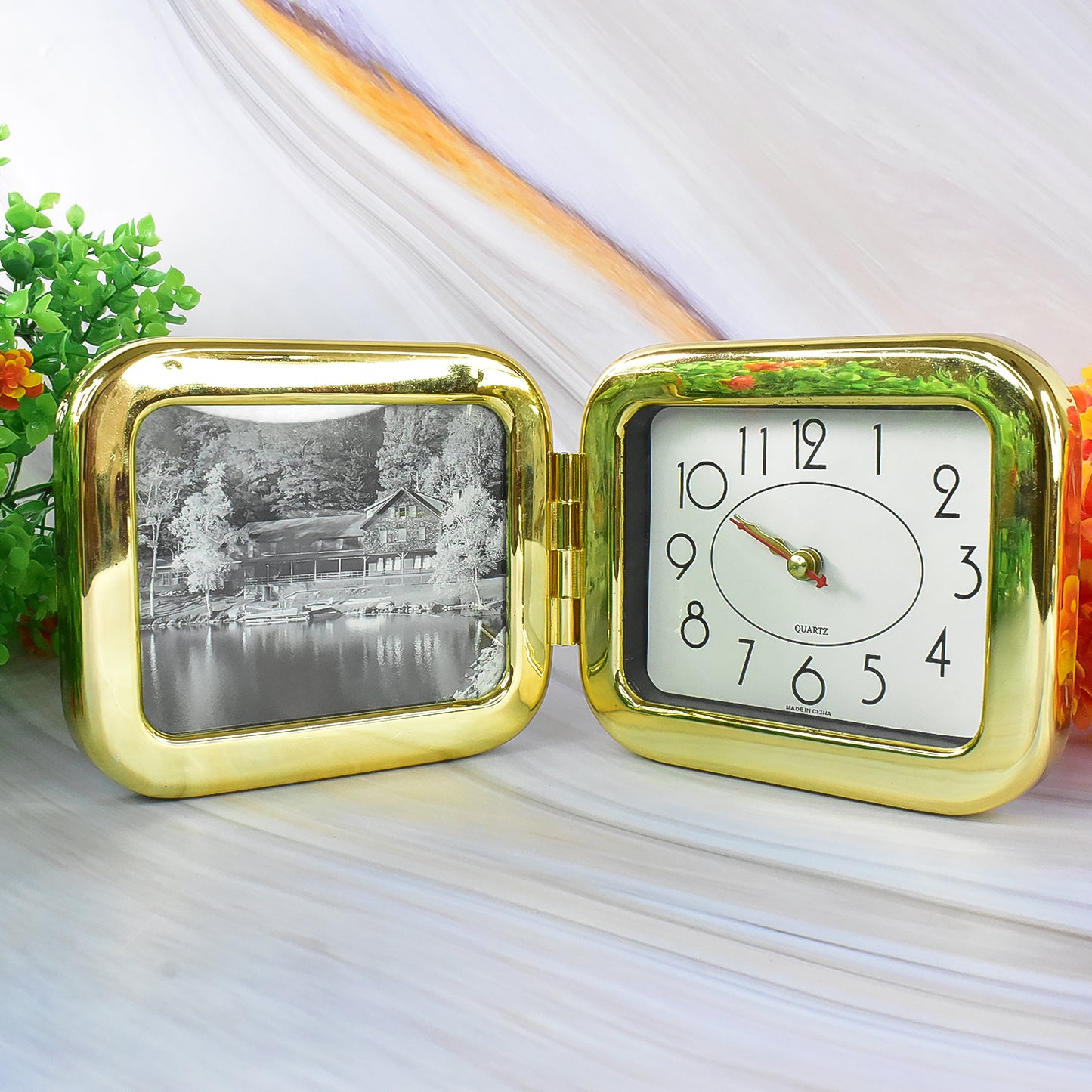 Wukusy portable foldable desk clock, space-saving and stylish design, placed on a home office desk for easy timekeeping.