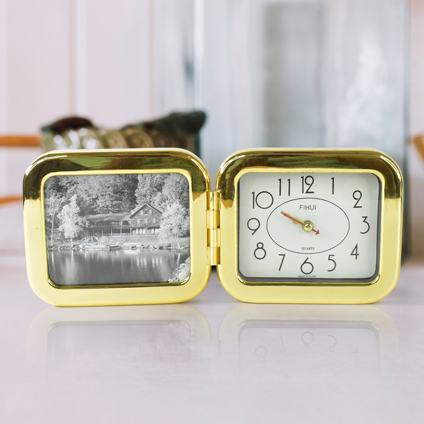 Wukusy portable foldable desk clock, stylish space-saving home improvement accessory with digital display on a sleek surface.