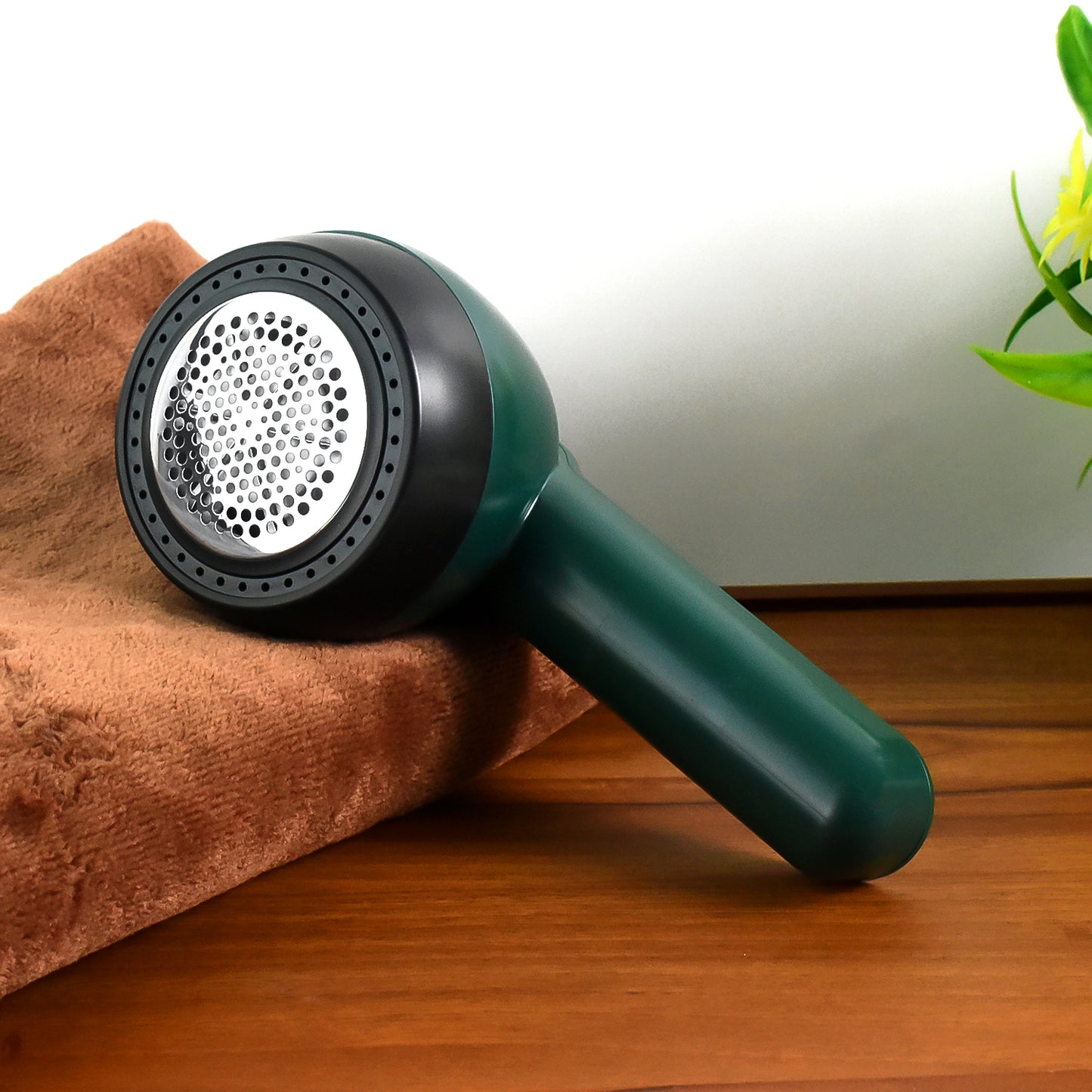 Wukusy portable lint remover with USB power cable, handheld device for removing lint from clothing and fabrics.