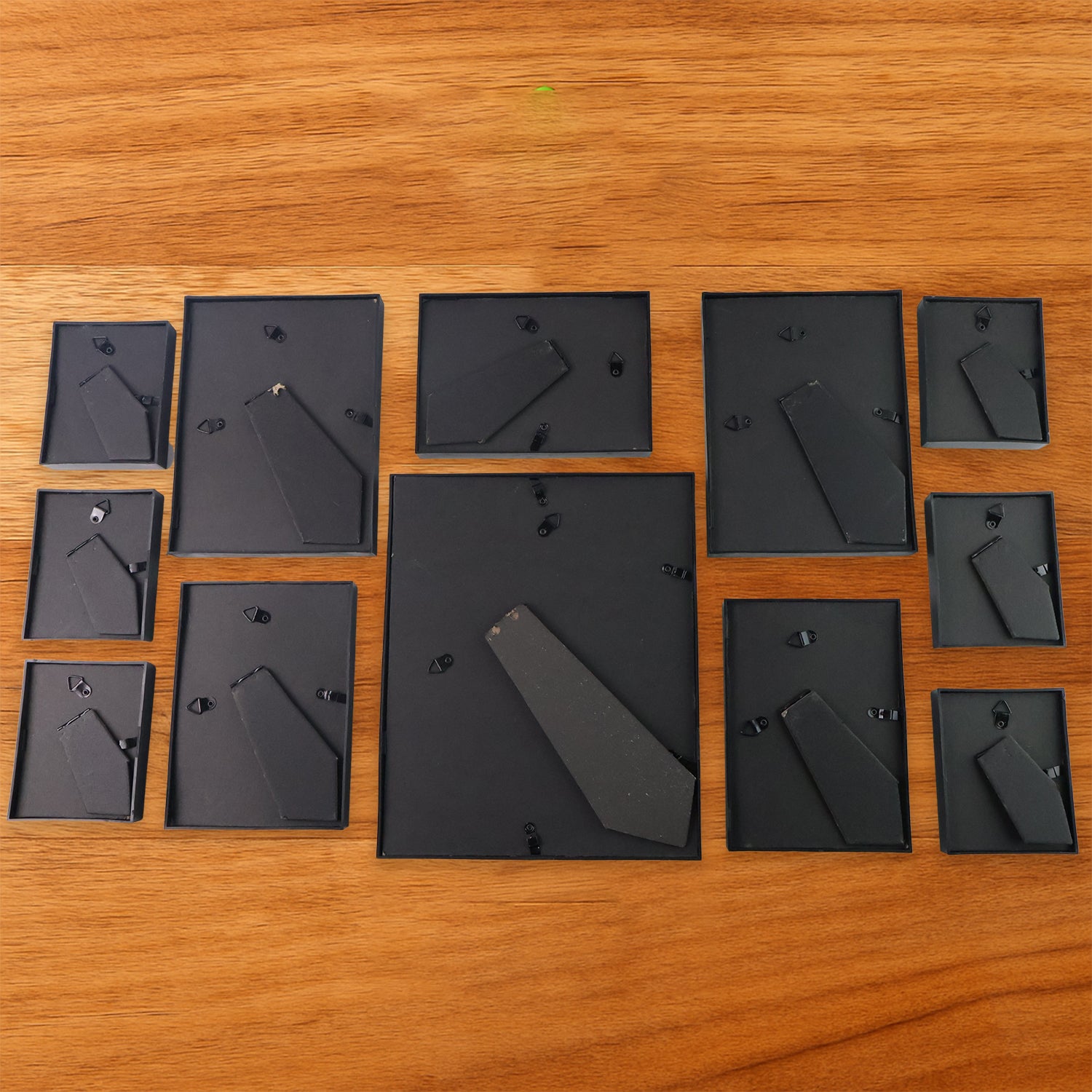 Set of 12 black photo frames by Wukusy, wall-hanging gallery frames for home decoration and photo display.