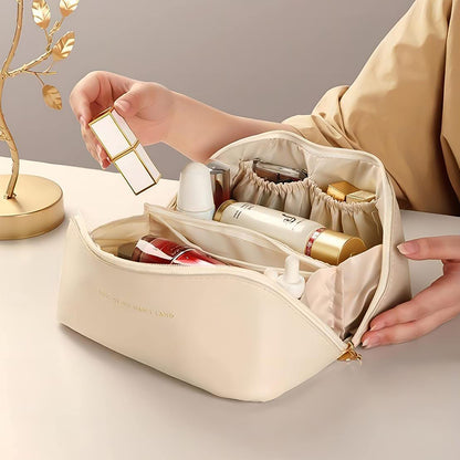 Wukusy premium cream travel makeup toiletry organizer pouch with zipper and handle, designed for compact home and travel storage