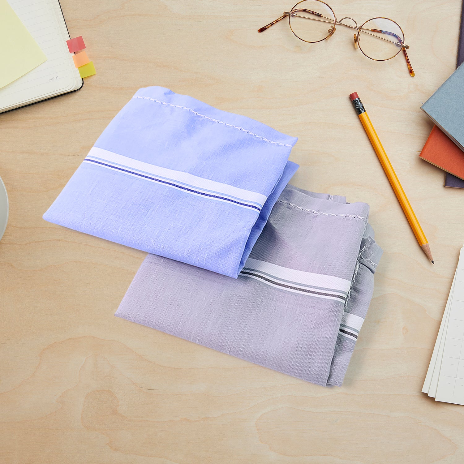 Soft cotton men's handkerchief from Wukusy, 40x40 cm, neatly folded, showcasing premium quality and smooth fabric.
