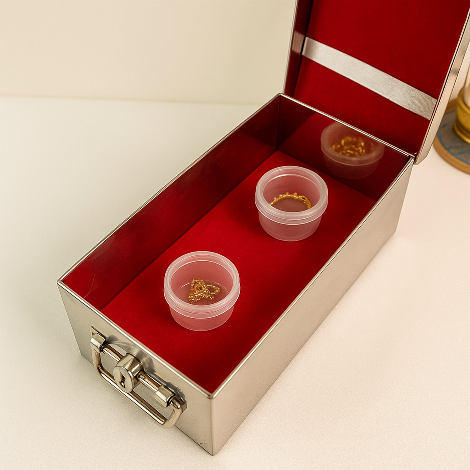 Wukusy premium stainless steel jewelry storage box with velvet lining, lock, and red interior for organized home jewelry storage.