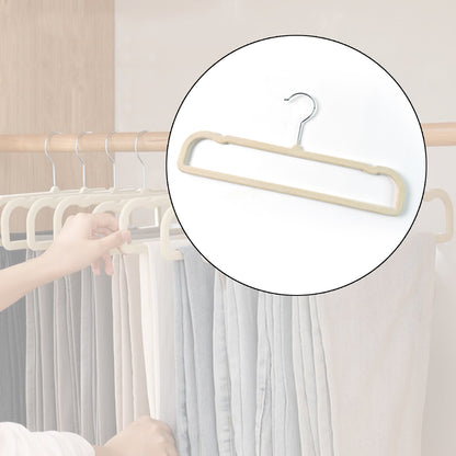 Wukusy premium velvet non-slip cloth hanger with metal hook for clothing, showing the soft velvet surface and sturdy hook.