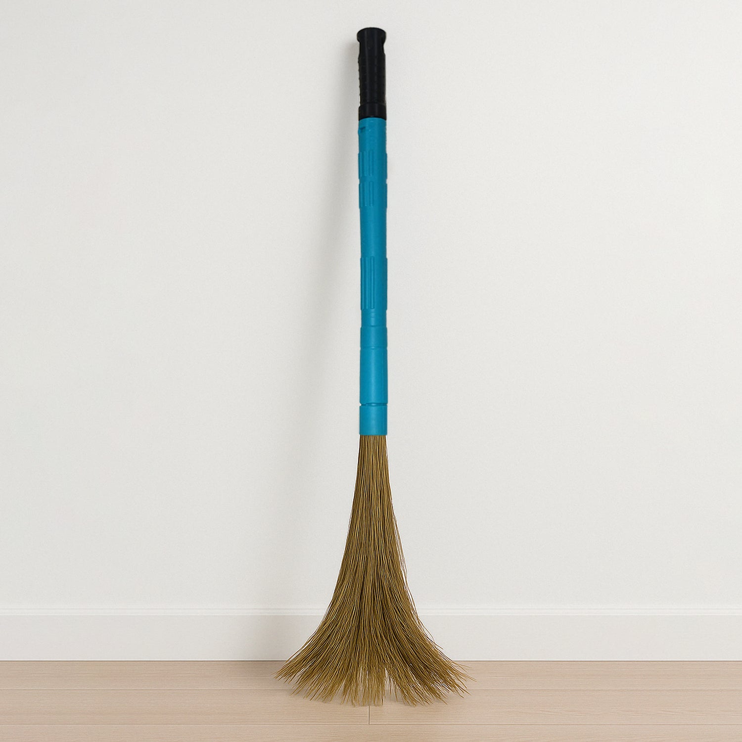 Wukusy Pro Clean expandable floor broom with plastic handle for home improvement, showing the broom's extendable design and sturdy handle.