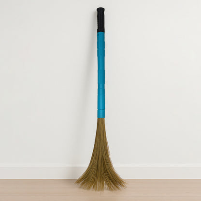 Wukusy Pro Clean expandable floor broom with plastic handle for home improvement, showing the broom's extendable design and sturdy handle.