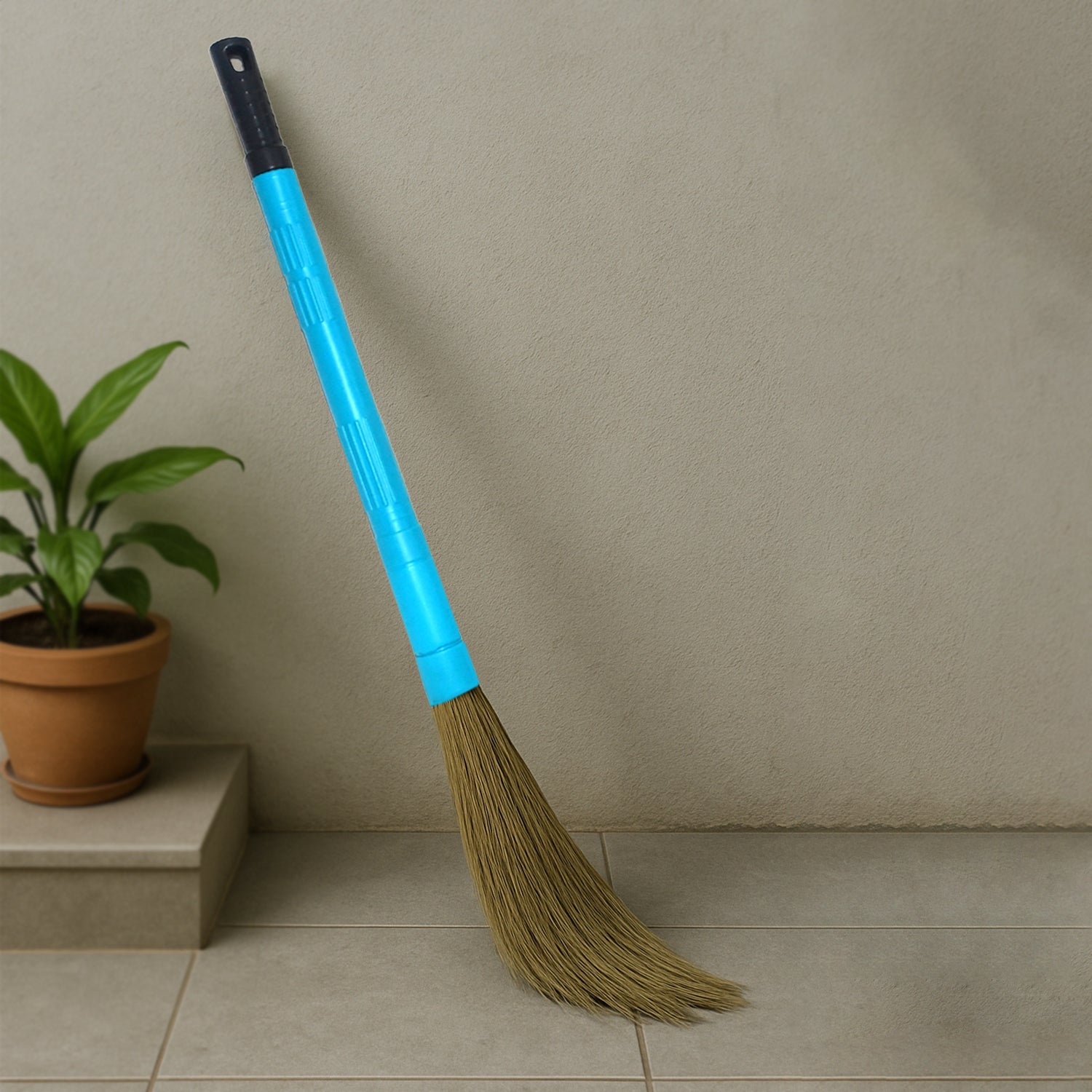 Wukusy Pro Clean expandable floor broom with plastic handle, ideal for home cleaning and sweeping floors.