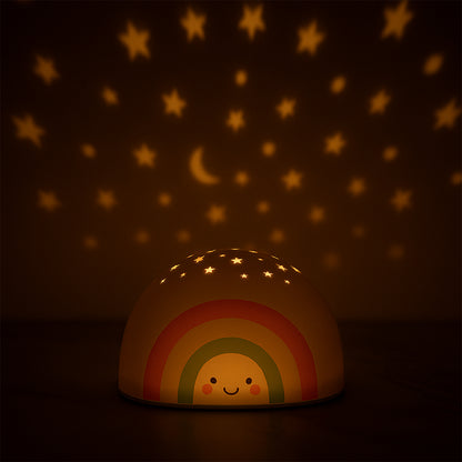 Wukusy rainbow projector LED night light for kids, illuminating colorful rainbow patterns in a cozy bedroom setting.