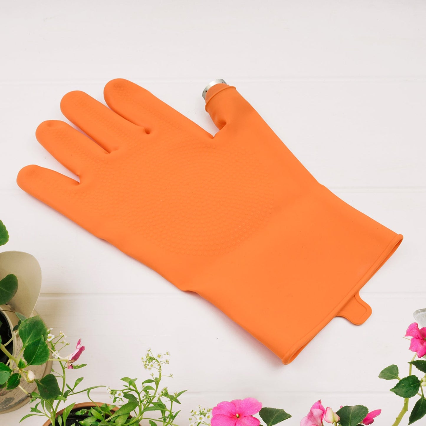 Right-handed silicone thumb cutter glove by Wukusy for home improvement, showing the glove's textured silicone surface and fit.