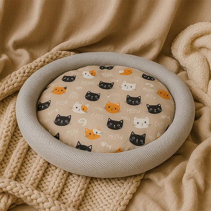 Soft plush round cat bed by Wukusy with cartoon cat print cushion, cozy and comfortable for pets.