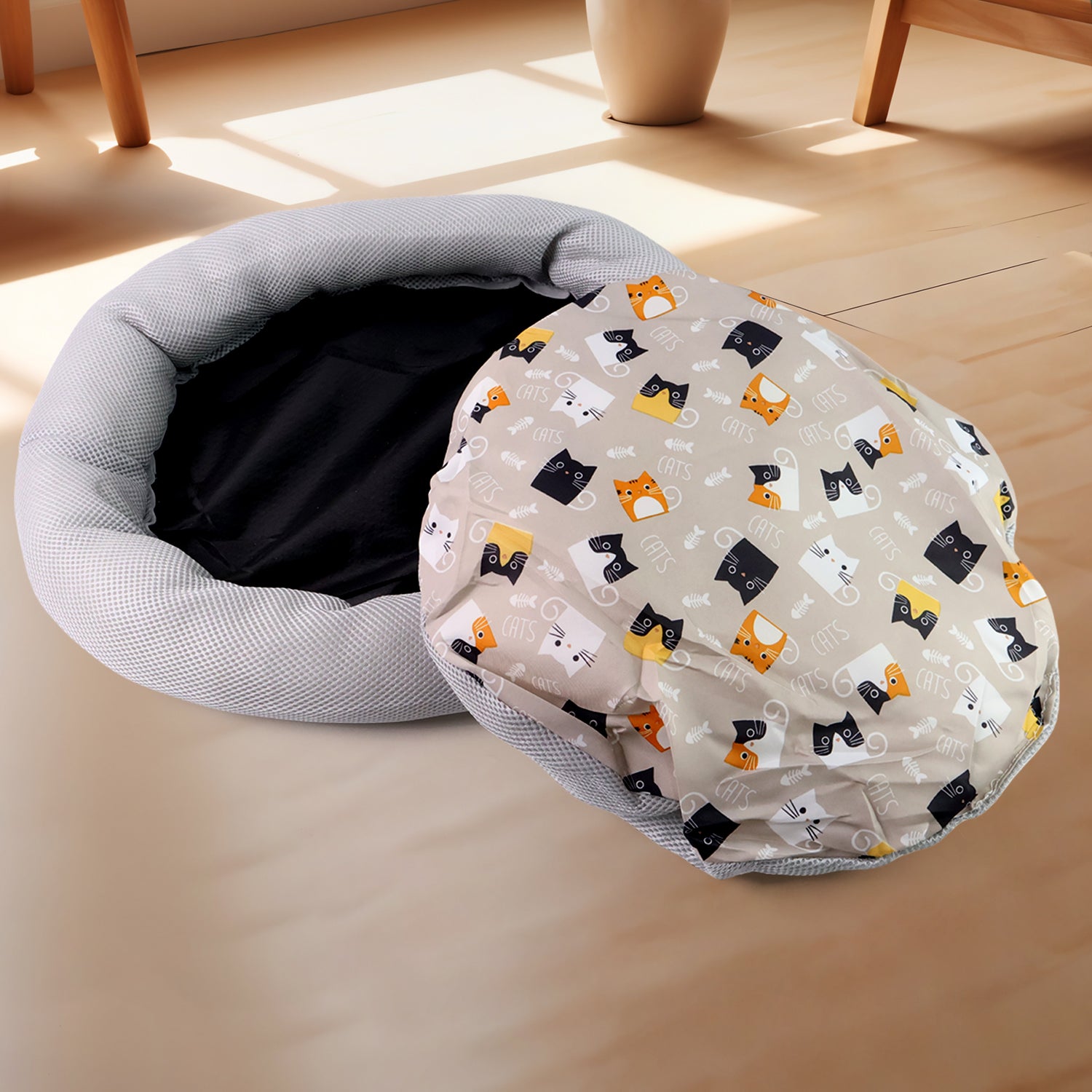 Round plush cat bed with cartoon cat print cushion, soft fabric, designed for cozy feline comfort, by Wukusy.