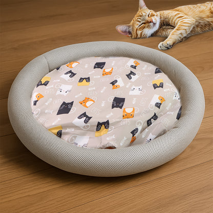 Round plush cat bed with cartoon cat print cushion, soft and cozy, perfect for small pets from Wukusy.