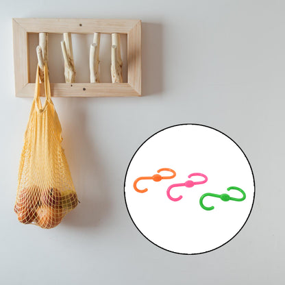 Set of three Wukusy S-shape plastic hooks for hanging clothes, ideal for home organization and closet storage.