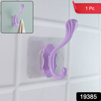 Wukusy heavy-duty self-adhesive decorative wall hook attached to a wall for hanging items in home improvement projects
