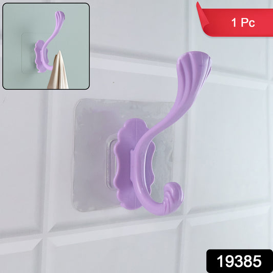 Wukusy heavy-duty self-adhesive decorative wall hook attached to a wall for hanging items in home improvement projects