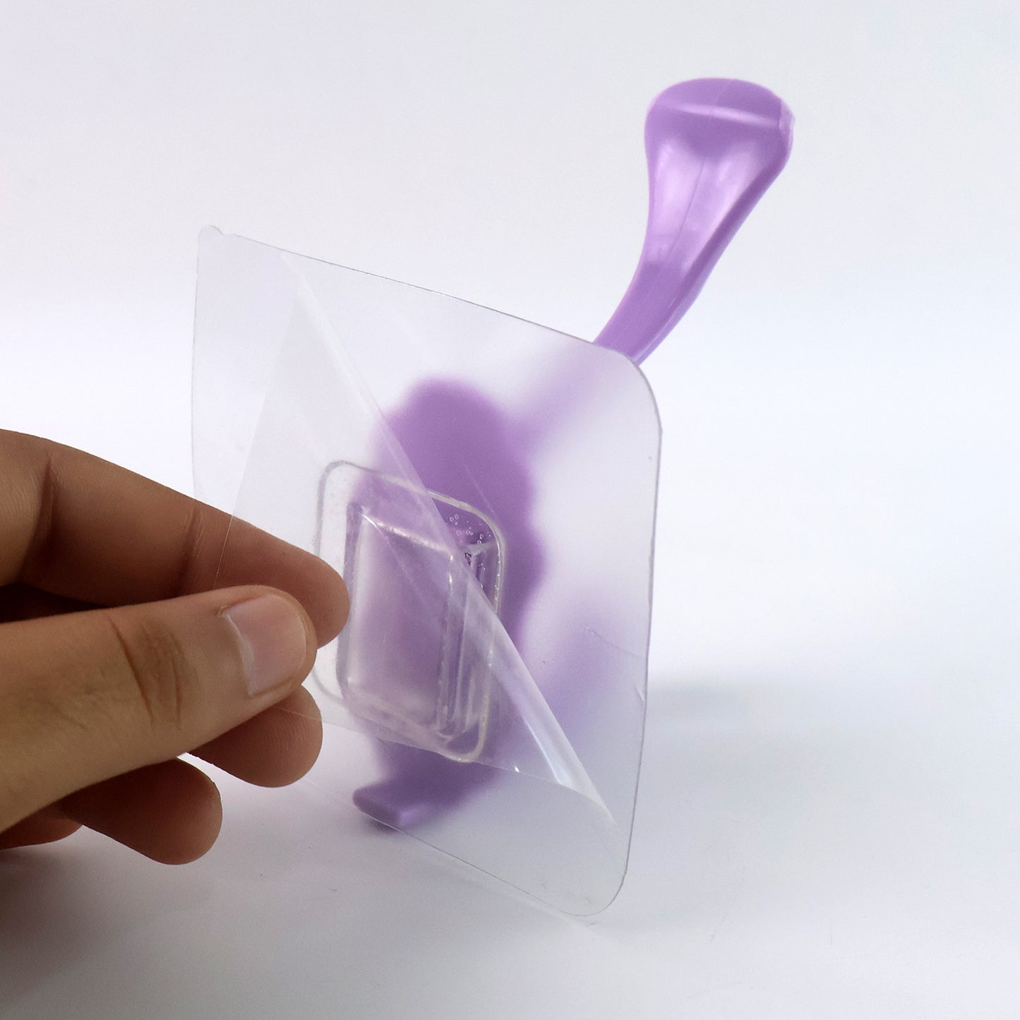 Wukusy heavy-duty self-adhesive decorative wall hook attached to a wall, ideal for home improvement and hanging items.