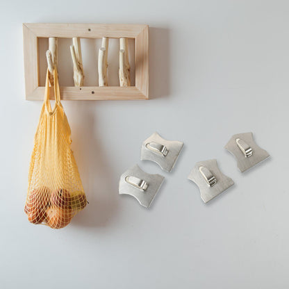 Stainless steel Wukusy heavy-duty self-adhesive wall hooks for hanging robes, towels, coats, kitchen, and bathroom accessories.