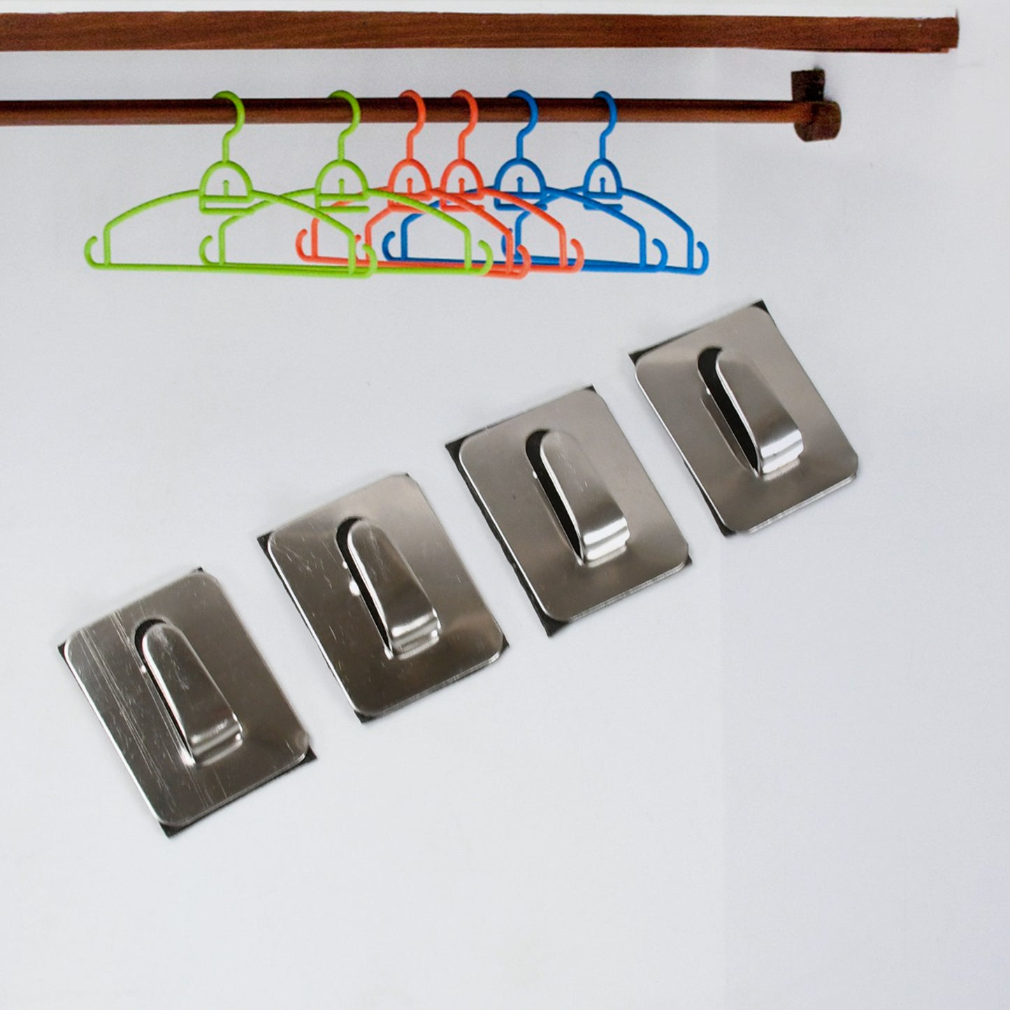 Wukusy stainless steel self-adhesive heavy-duty wall hooks for hanging robes, coats, towels in kitchen, bathroom, or home.