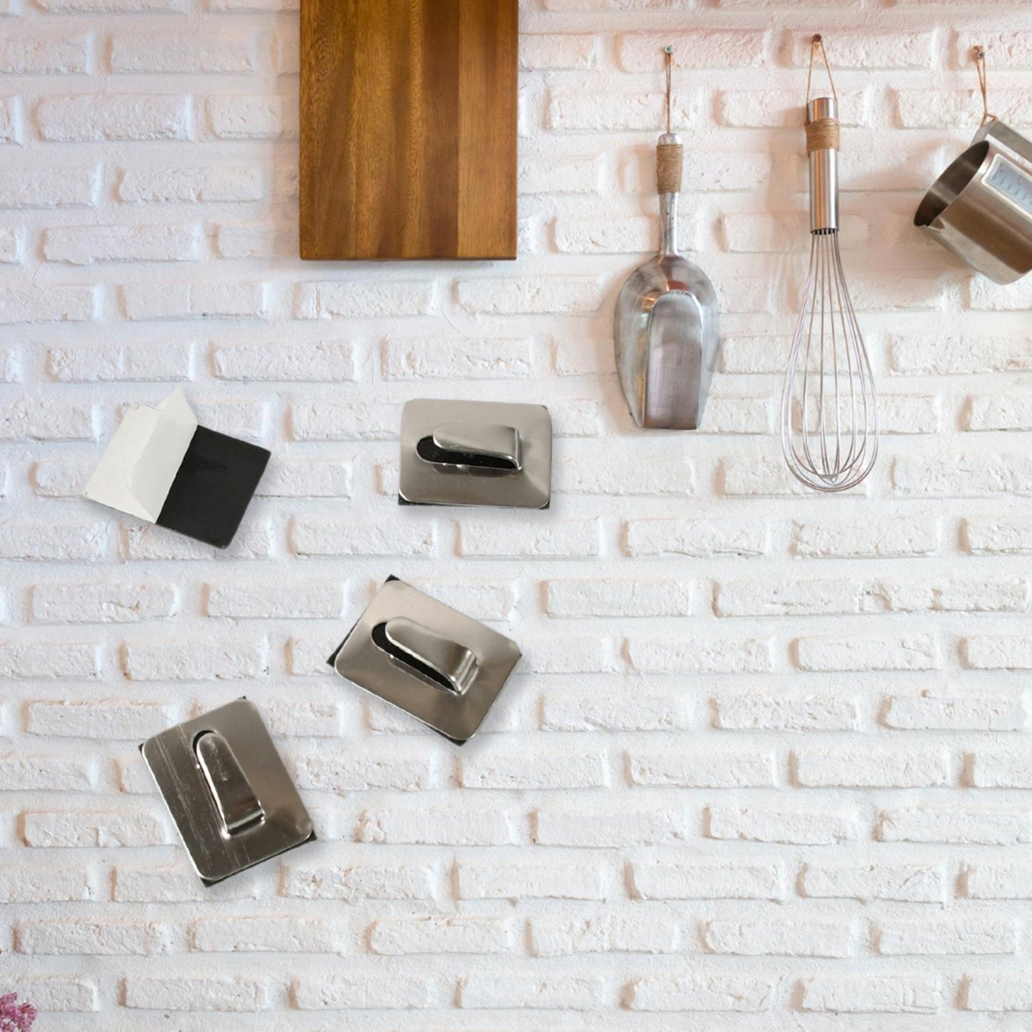 Stainless steel Wukusy heavy-duty self-adhesive wall hooks for hanging robes, towels, coats, and kitchen or bathroom items.