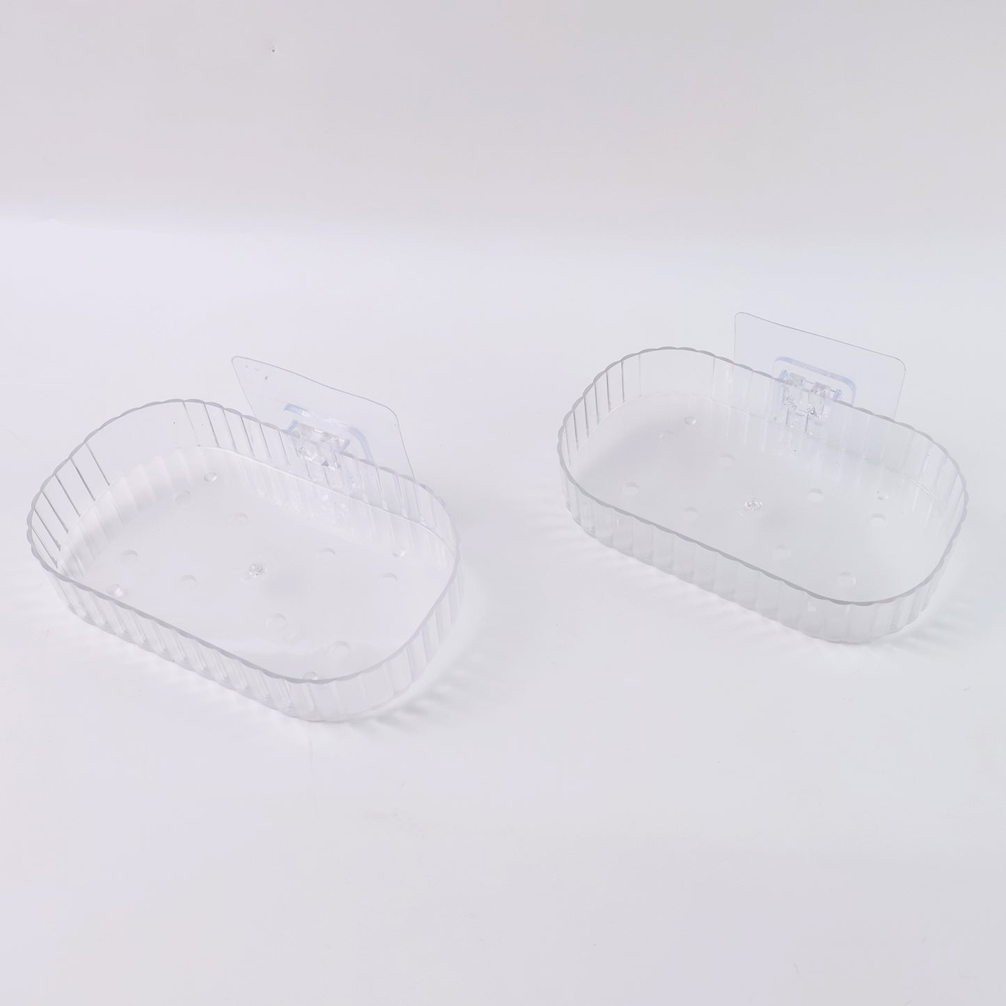 Two transparent, wall-mounted soap dish holders with self-adhesive backing from Wukusy for home improvement.