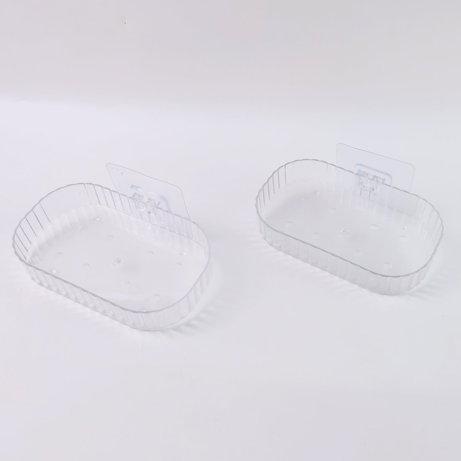Two transparent, wall-mounted soap dish holders with self-adhesive backing from Wukusy for home improvement.