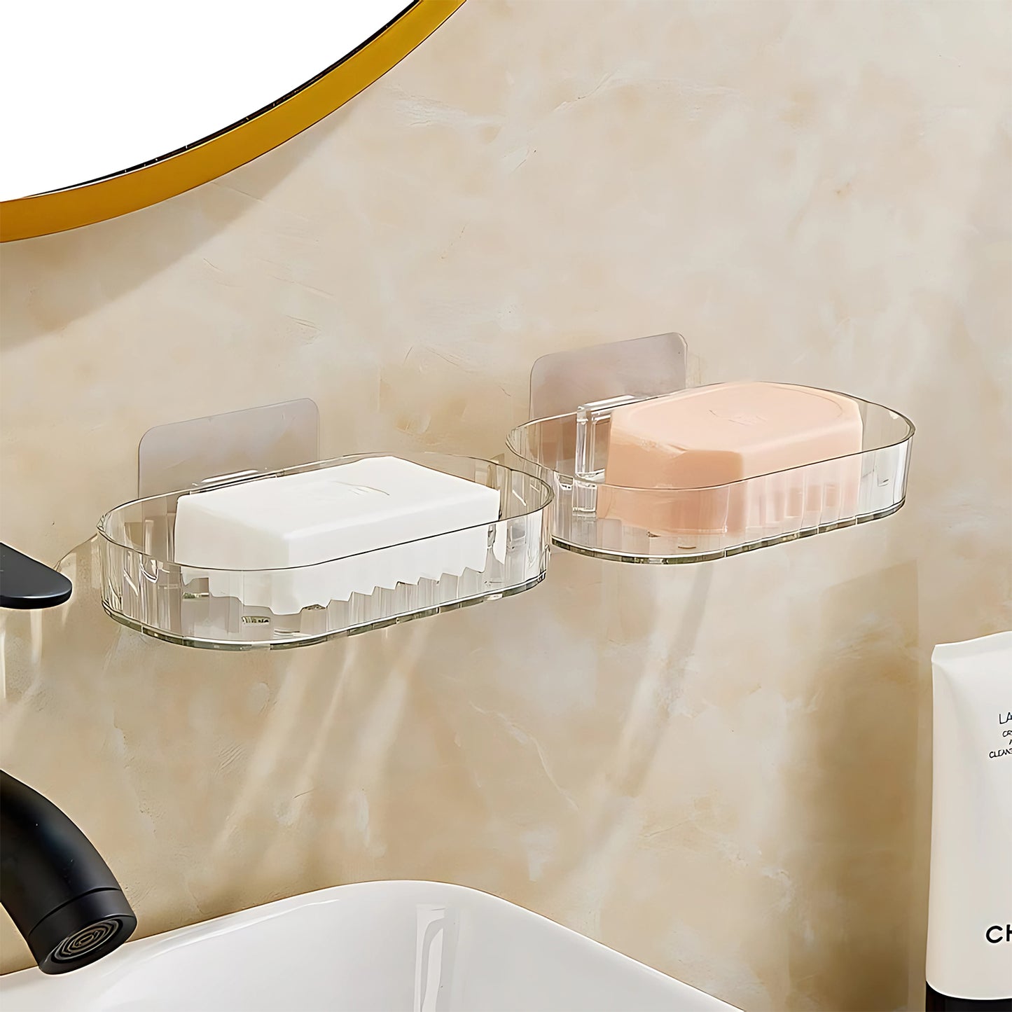 Pair of transparent, wall-mounted soap dish holders by Wukusy with self-adhesive backing for easy home improvement installation.