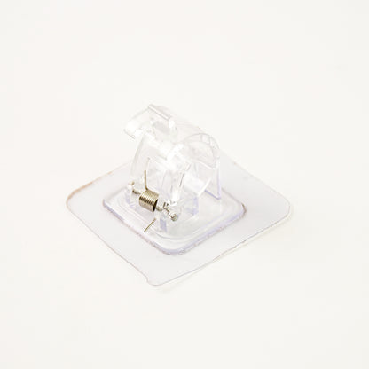 Self-adhesive transparent wall with spring-loaded anti-slip clip by Wukusy for home improvement, shown attached to a wall.