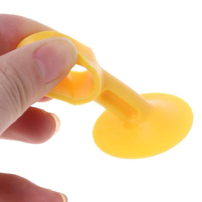 Set of two Wukusy self-sucking silicone door stoppers for home improvement, designed to hold doors securely in place.