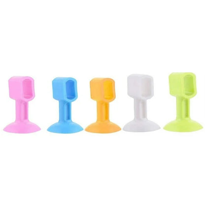 Set of five Wukusy self-sucking silicone door stoppers for home improvement, designed to hold doors securely in place.