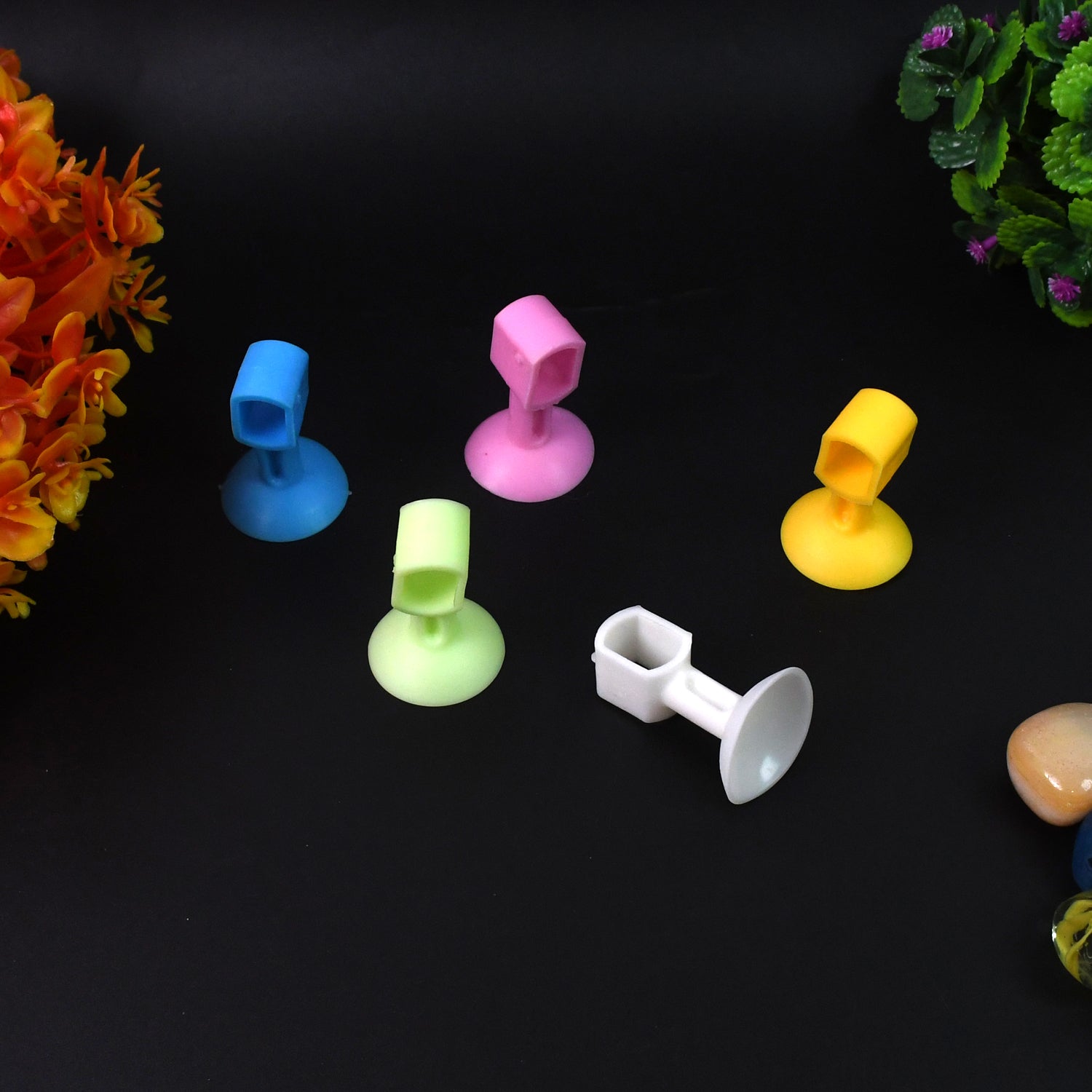 Set of five Wukusy self-sucking silicone door stoppers for home improvement, designed to hold doors securely in place.