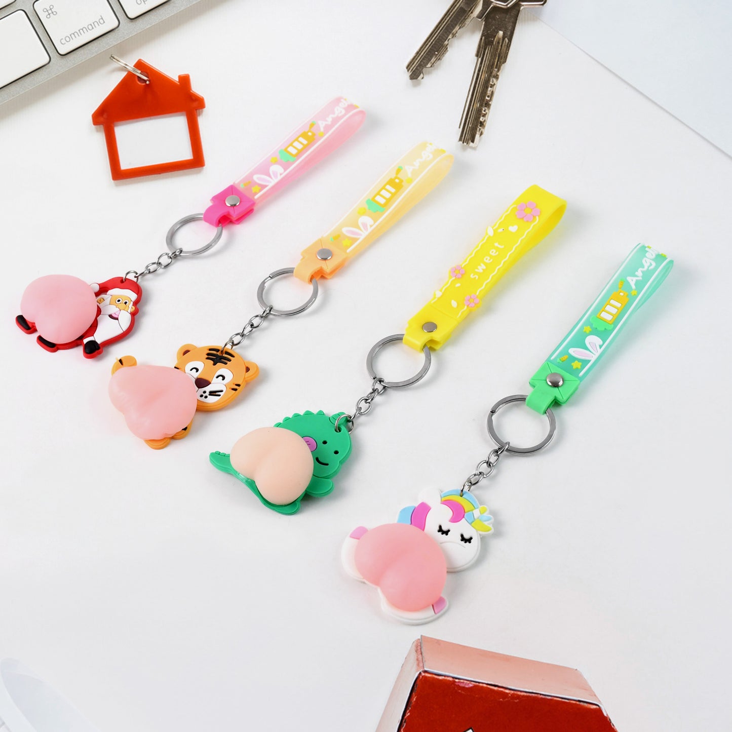 Wukusy silicone keychain with wrist strap squeeze toy in mixed designs, perfect for home improvement and everyday carry.