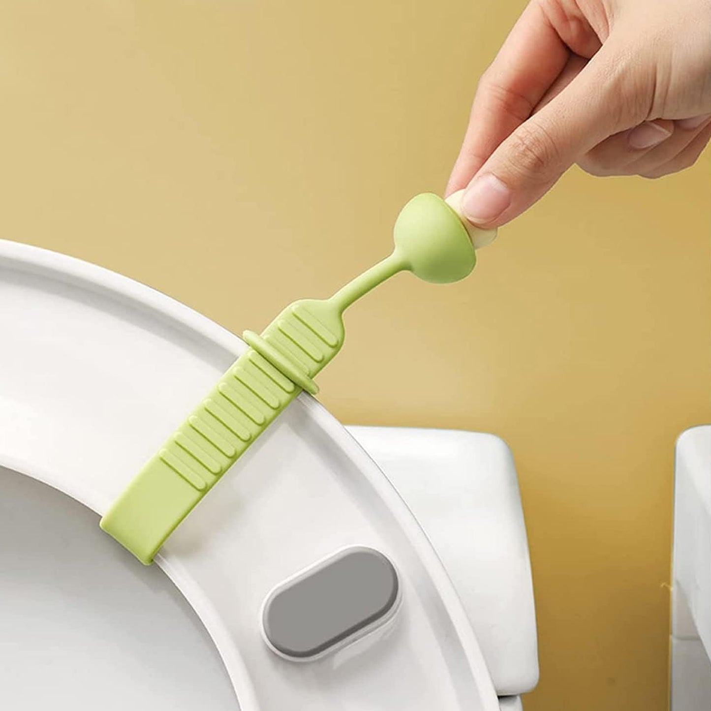 Wukusy silicone toilet seat lifter band, home improvement tool for easier toilet seat lifting, shown in close-up view.