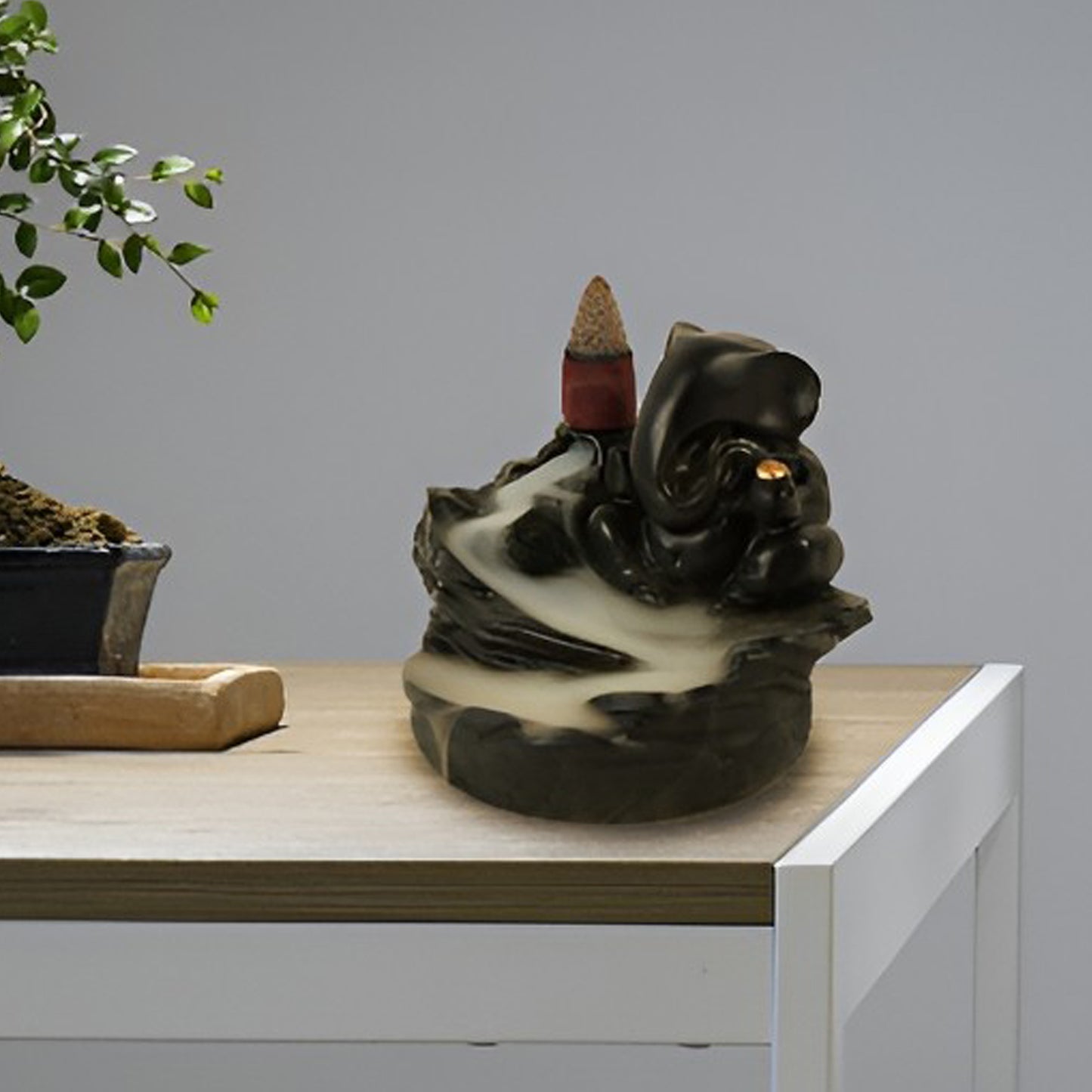 Wukusy Ganesha idol decoration with smoke fountain feature and 8 backflow incense cones, ideal for home improvement and festive decor.