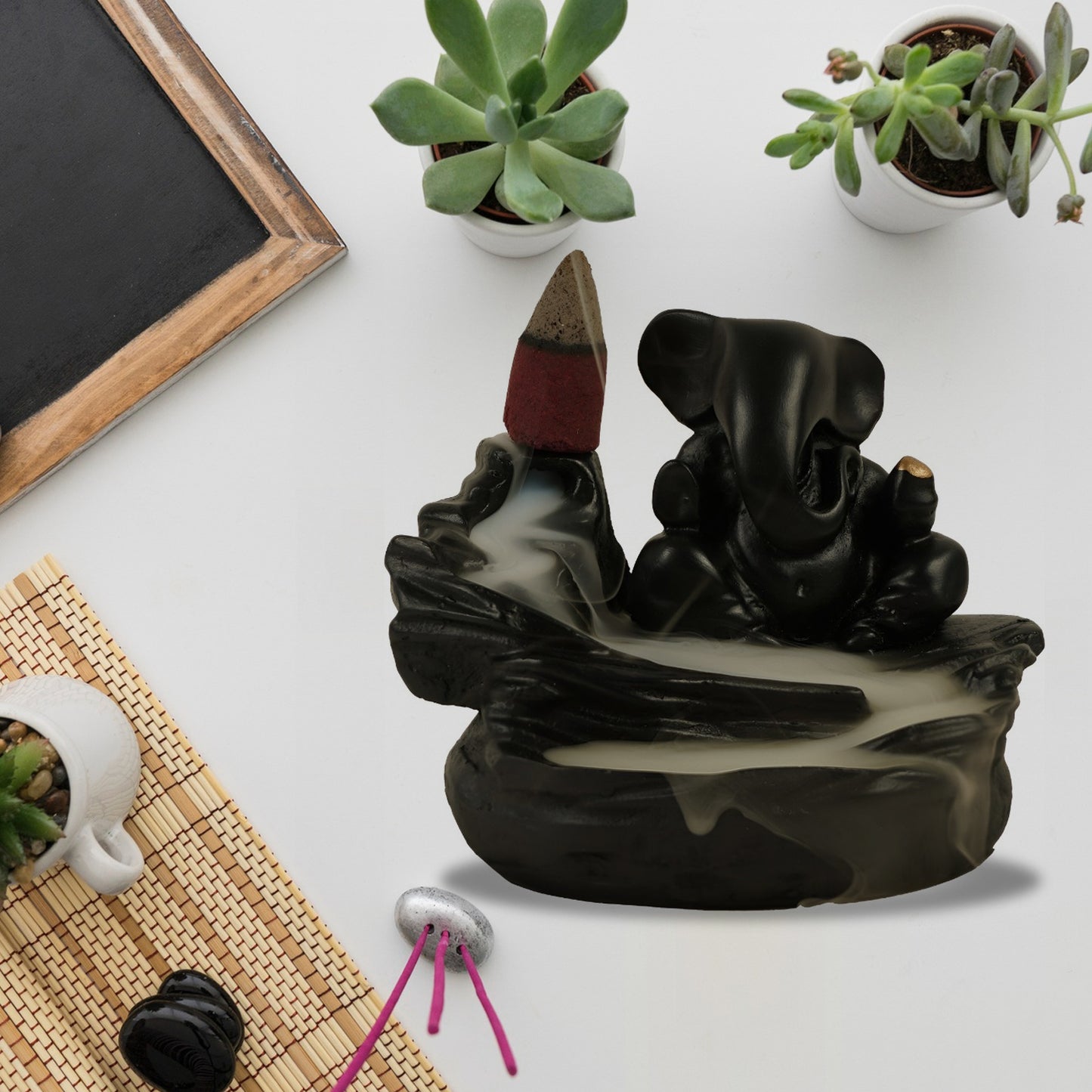 Wukusy Ganesha idol with smoke fountain decoration and 8-piece backflow incense cones for home improvement decor.